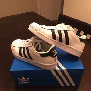 White Adidas Superstars